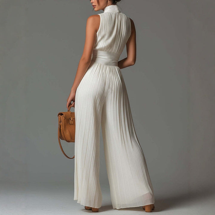 Tuta in chiffon bianca senza maniche con scollo a V, zip e pantaloni a gamba larga plissettati