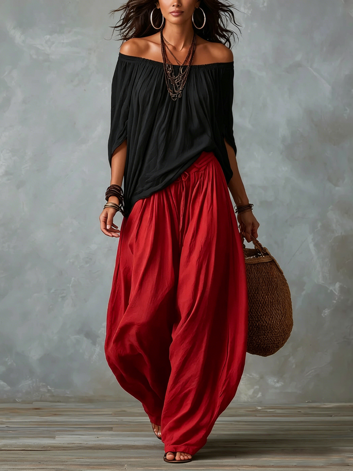 Top Nero Off-shoulder e Pantaloni Lantern Rossi Scollo Largo