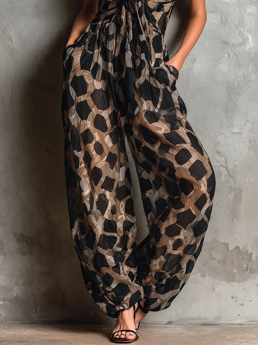Tuta ampia in chiffon con stampa animale nera e scollo all'americana